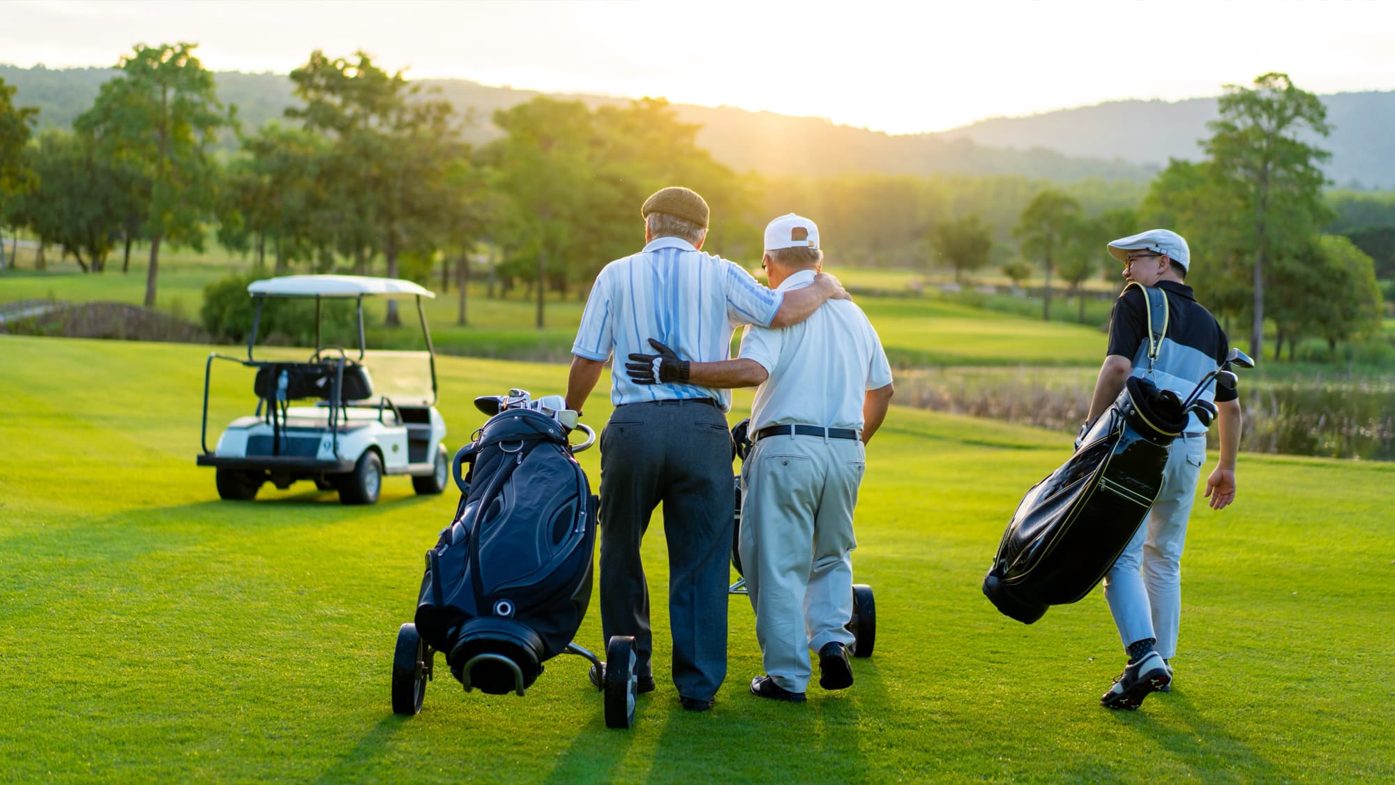 Group of friends on the golf course at sunset